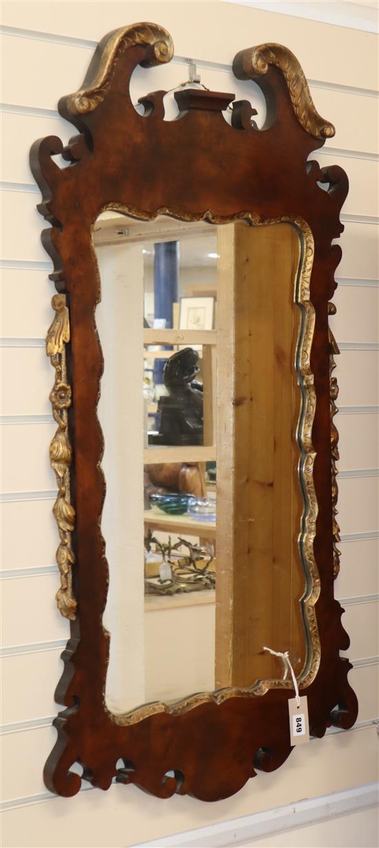 An 18th century style parcel gilt walnut fret cut wall mirror H.108cm